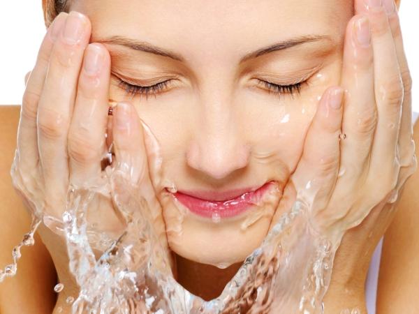 160042417-woman-washing-face-600x450