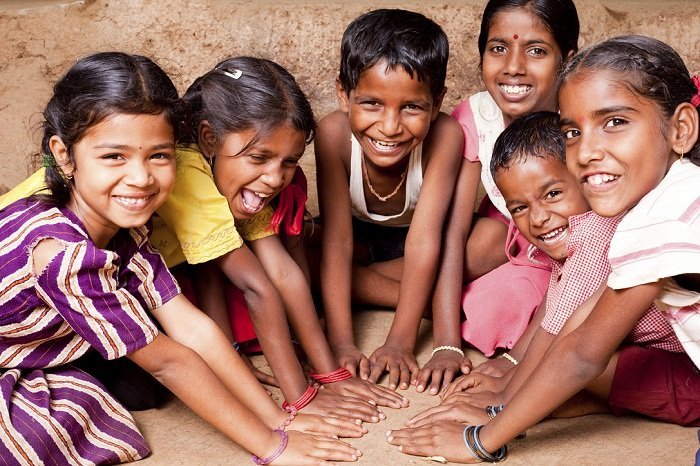 Group of Cheerful Rural Indian Children joining hands